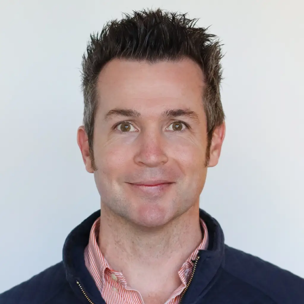 Headshot of the chief financial officer, smiling against a light background.